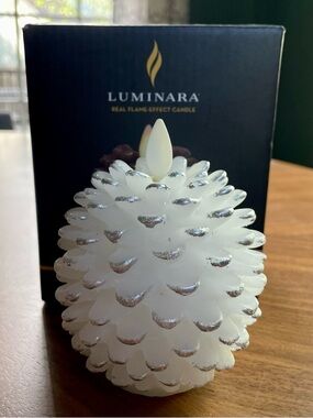 new Luminara white pinecone candle open box